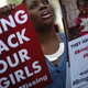 A woman holds a sign as other protesters gather outside the Nigeria House in London April 14, 2015, to mark the one-year anniversary since a group of Nigerian schoolgirls were abducted in Nigeria.
Dan Kitwood/Getty Images